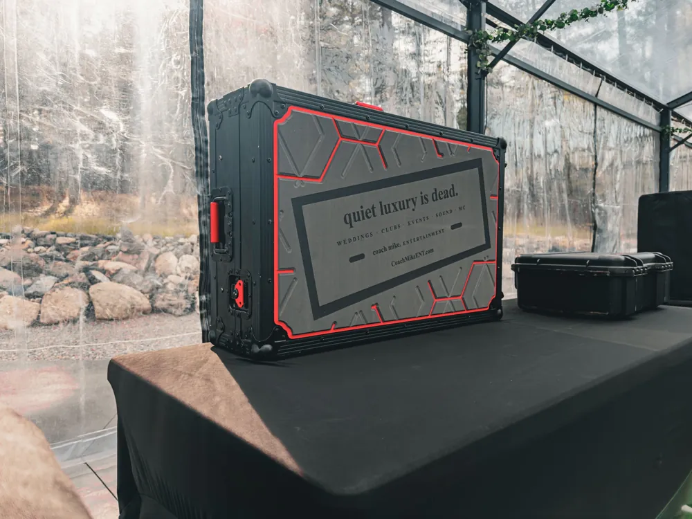 Coach Mike Entertainment road case printed with “quiet luxury is dead.”