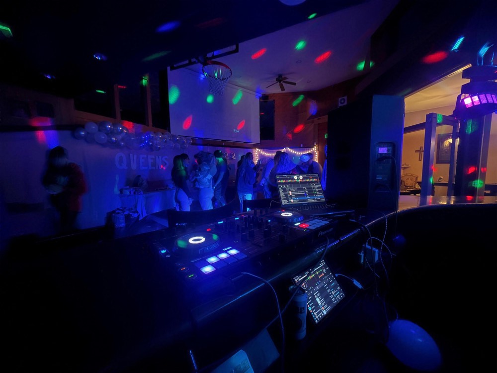 DJ booth under purple and blue lights