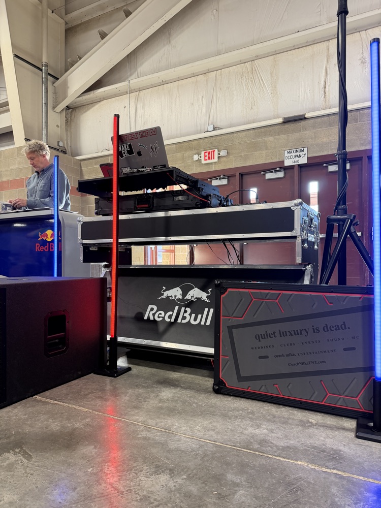 DJ decks on a flight case with a red LED pillar
